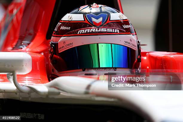 Max Chilton of Great Britain and Marussia sits in his car in the garage during day two of testing at Silverstone Circuit on July 9, 2014 in...