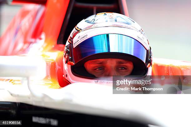 Max Chilton of Great Britain and Marussia sits in his car in the garage during day two of testing at Silverstone Circuit on July 9, 2014 in...