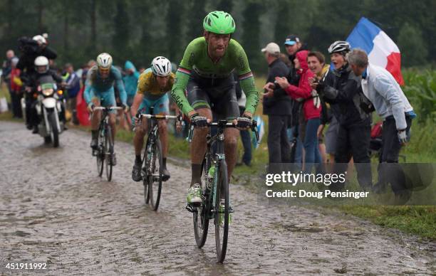 Lars Boom of The Netherlands and the Belkin Pro Cycling Team enters the final sections of cobbles en route to victory in stage five of the 2014 Le...