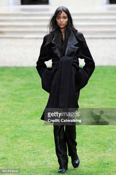Model walks the runway at the Rad Hourani Autumn Winter 2014 fashion show during Paris Haute Couture Fashion Week on July 9, 2014 in Paris, France.