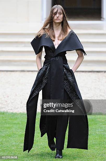 Model walks the runway at the Rad Hourani Autumn Winter 2014 fashion show during Paris Haute Couture Fashion Week on July 9, 2014 in Paris, France.