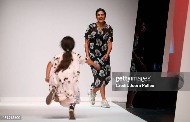 Designer Leyla Piedayesh acknowledges the audience after the LaLa Berlin show during the Mercedes-Benz Fashion Week Spring/Summer 2015 at Tischlerei...