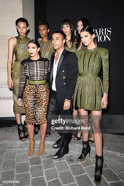French Stylist Olivier Rousteing poses with Kim Kardashian and her sister Kendall Jenner and Balmain Army models Binx Walton, Ysaunny Brito, Issa...