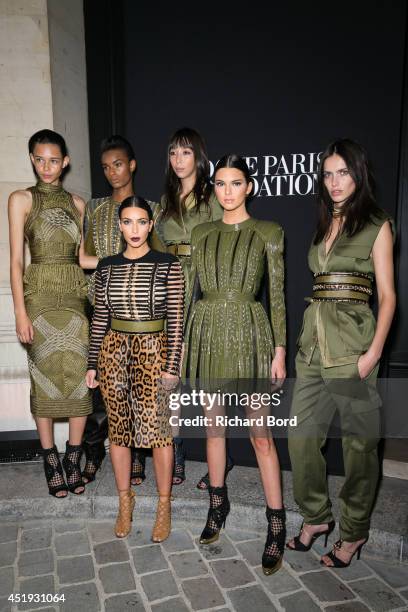 Balmain Army models Binx Walton, Ysaunny Brito, Issa Lish, Amanda Wellsh, Kim Kardashian and her sister Kendall Jenner attend the Vogue Foundation...
