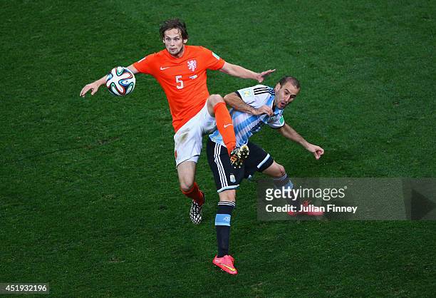Daley Blind of the Netherlands and Rodrigo Palacio of Argentina compete for the ball during the 2014 FIFA World Cup Brazil Semi Final match between...