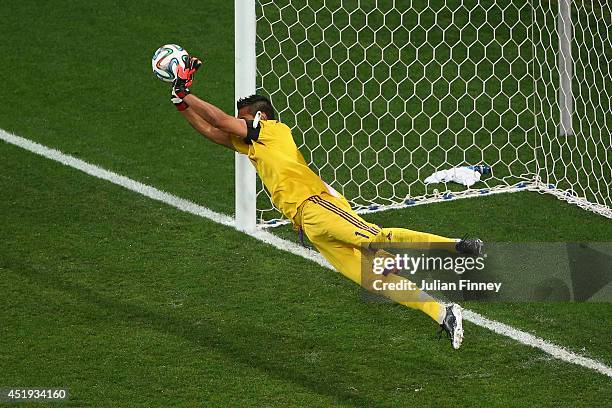 Sergio Romero of Argentina saves the penalty kick of Wesley Sneijder of the Netherlands in a shootout during the 2014 FIFA World Cup Brazil Semi...