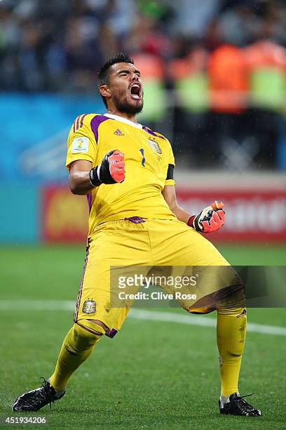 Sergio Romero of Argentina celebrates saving the penalty kick of Wesley Sneijder of the Netherlands in a shootout during the 2014 FIFA World Cup...