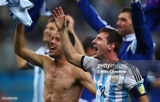 Lionel Messi of Argentina celebrates defeating the Netherlands in a shootout during the 2014 FIFA World Cup Brazil Semi Final match between the...