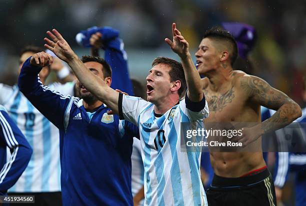 Lionel Messi of Argentina celebrates defeating the Netherlands in a shootout during the 2014 FIFA World Cup Brazil Semi Final match between the...