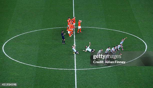 Argentina players celebrate defeating the Netherlands in a shootout during the 2014 FIFA World Cup Brazil Semi Final match between the Netherlands...