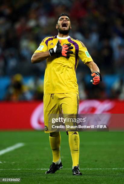 Sergio Romero of Argentina reacts after saving a penalty by Ron Vlaar of the Netherlands in the penalty shootout during the 2014 FIFA World Cup...