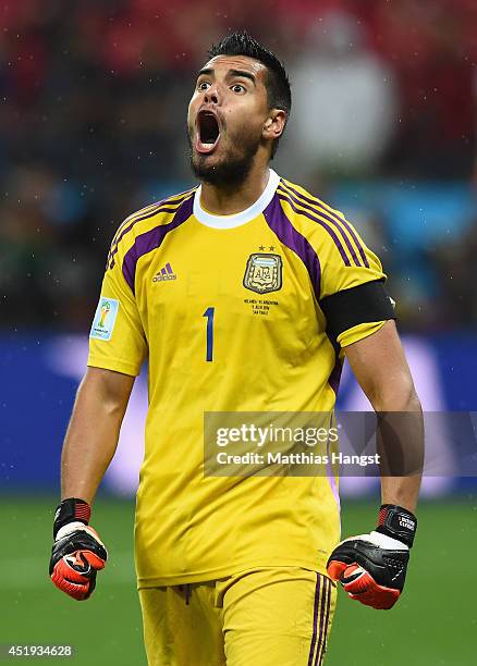 Sergio Romero of Argentina celebrates saving the penalty kick of Wesley Sneijder of the Netherlands in a shootout during the 2014 FIFA World Cup...