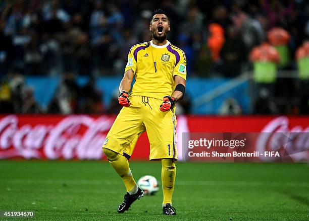 Sergio Romero of Argentina reacts after saving a penalty by Ron Vlaar of the Netherlands in the penalty shootout during the 2014 FIFA World Cup...