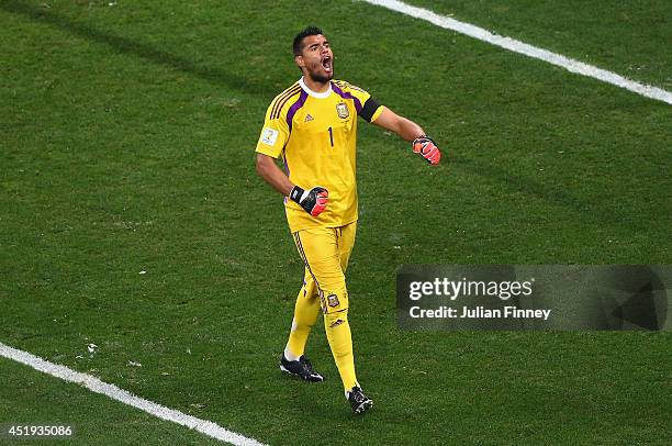 Sergio Romero of Argentina celebrates saving the penalty kick of Wesley Sneijder of the Netherlands in a shootout during the 2014 FIFA World Cup...