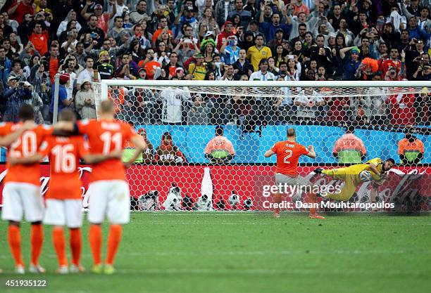 Sergio Romero of Argentina saves the penalty kick of Ron Vlaar of the Netherlands in a shootout during the 2014 FIFA World Cup Brazil Semi Final...