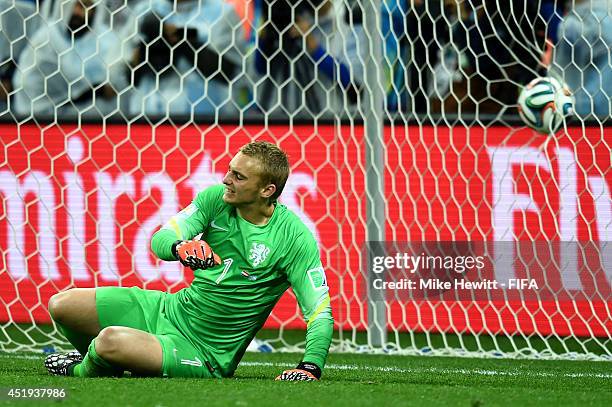 Jasper Cillessen of the Netherlands reacts after failing to stop the penalty kick by Lionel Messi of Argentina in the penalty shootout during the...