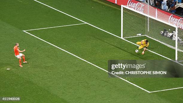 Argentina's goalkeeper Sergio Romero reacts saves a penalty from Netherlands' defender Ron Vlaar failed during a penalty shoot out of the semi-final...