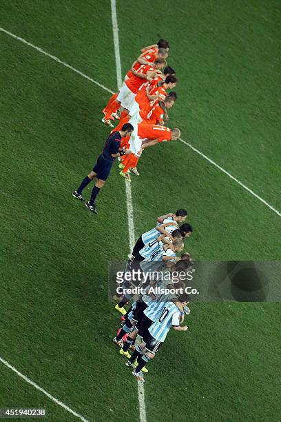 Netherlands and Argentina players waits for the penalty shoot out during the 2014 FIFA World Cup Brazil Semi Final match between Netherlands and...
