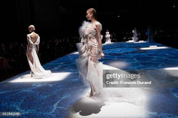 Models walk the runway during the Lan YU show as part of Paris... News ...