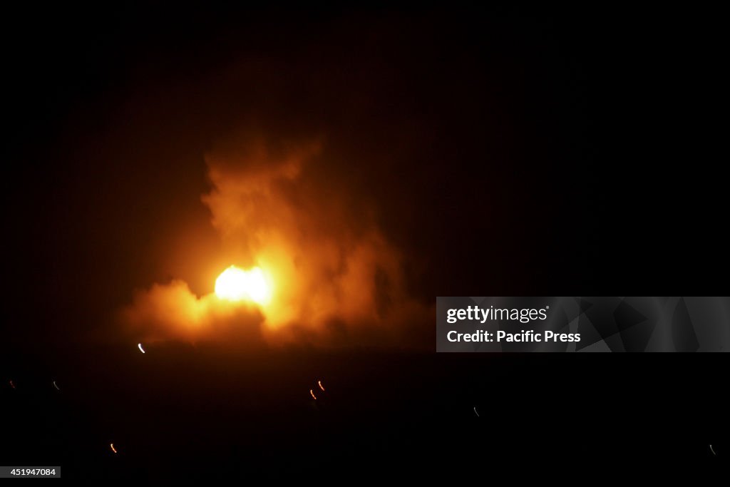A fireball rises following an Israeli missile strike on the...