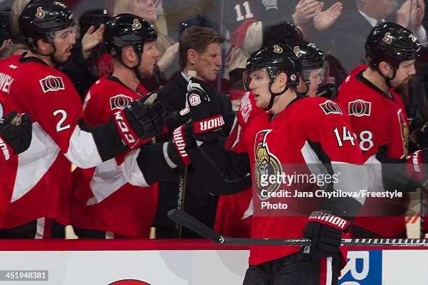 Colin Greening of the Ottawa Senators celebrates a late first period goal with Teammates Jared Cowen, and Marc Methot during an NHL game against the...