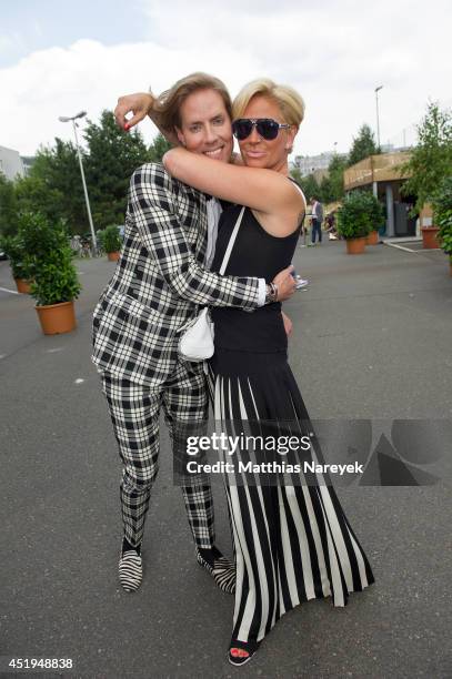 Jens Hilbert and Claudia Effenberg attends the Marcel Ostertag show during the Mercedes-Benz Fashion Week Spring/Summer 2015 at Erika Hess Eisstadion...