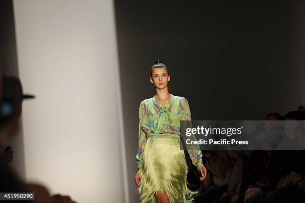 Female model wears Marcel Ostertag's collection during the Mercedes-Benz Fashion Week Berlin Spring/Summer 2015 at Erika Hess Eisstadion.