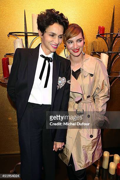 Farida Khelfa and Louise Bourgoin attend the Jean Paul Gaultier show as part of Paris Fashion Week - Haute Couture Fall/Winter 2014-2015 at 325 Rue...