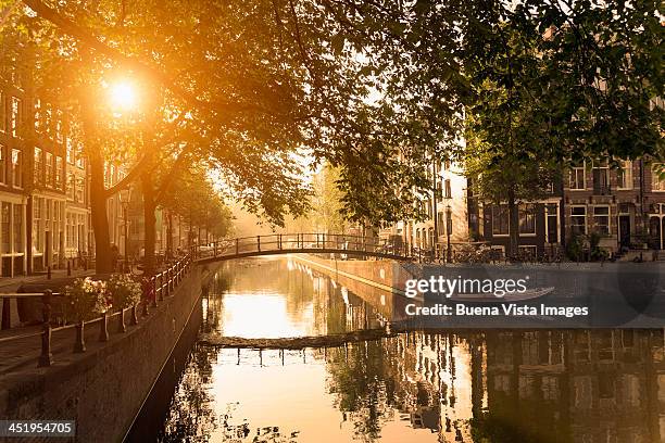 bridge over brouwersgracht canal at sunset - amsterdam stock pictures, royalty-free photos & images