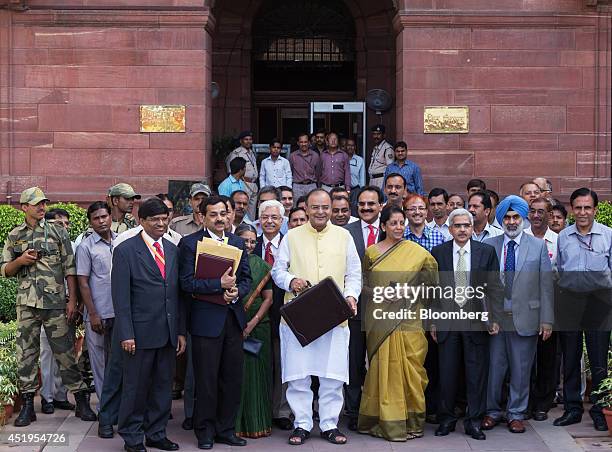 Arun Jaitley, India's finance minister, front row center, Pompa Babbar, financial commissioner of railways, front row third left, Arvind Mayaram,...