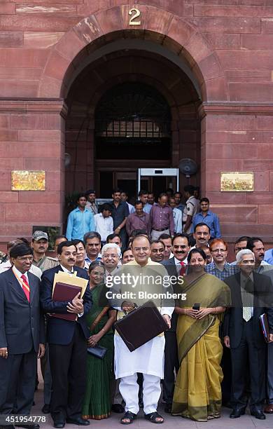 Arun Jaitley, India's finance minister, front row center, Pompa Babbar, financial commissioner of railways, front row third left, Arvind Mayaram,...