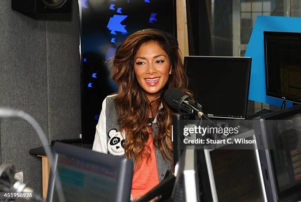 Nicole Scherzinger visits Kiss.FM at Kiss FM Studio's on July 10, 2014 in London, England.