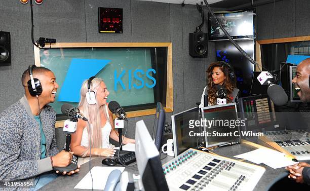 Nicole Scherzinger talks with Ricky Haywood Williams, Melvin O'Doom and Charlie Hedges as she visits Kiss.FM at Kiss FM Studio's on July 10, 2014 in...