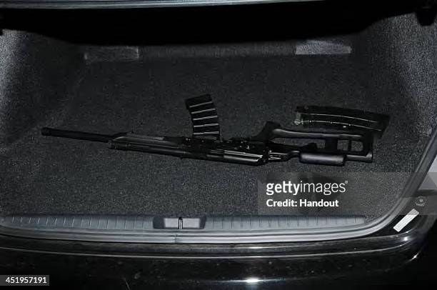 In this handout crime scene evidence photo provided by the Connecticut State Police, shows a shotgun inside the trunk of the shooter's car at Sandy...