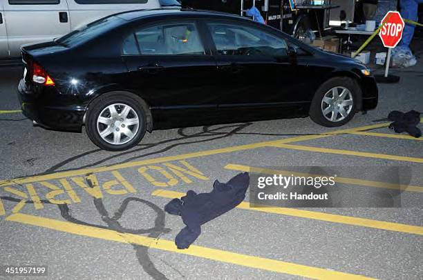 In this handout crime scene evidence photo provided by the Connecticut State Police, shows the shooter's car outside Sandy Hook Elementary School...