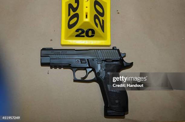 In this handout crime scene evidence photo provided by the Connecticut State Police, shows a Sig Sauer P226 9mm found on shooters person in Room 10...