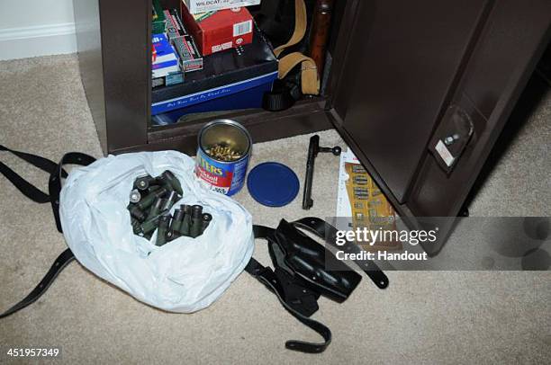 In this handout crime scene evidence photo provided by the Connecticut State Police, shows ammunition infrot of a gun safe in the south east bedroom...