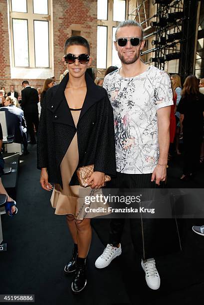 Alina Sueggeler and Andi Weizel attend the Schumacher show during the Mercedes-Benz Fashion Week Spring/Summer 2015 at Sankt Elisabeth Kirche on July...