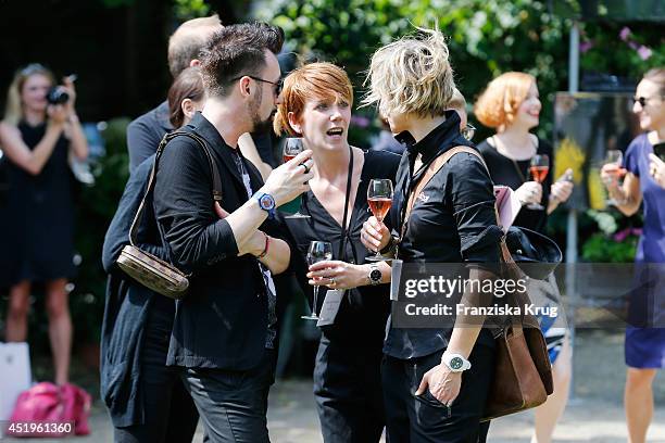 Guests attend the Schumacher show during the Mercedes-Benz Fashion Week Spring/Summer 2015 at Sankt Elisabeth Kirche on July 10, 2014 in Berlin,...