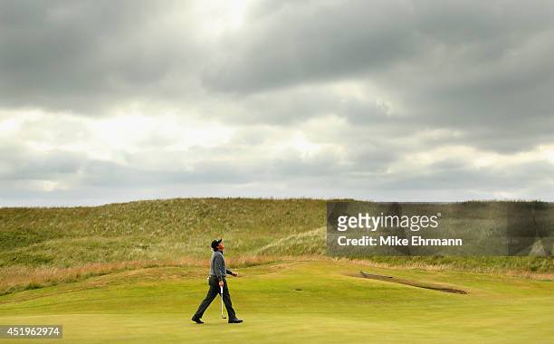 Phil Mickelson of the United States reacts to a putt on the fourth hole during the 2014 Aberdeen Asset Management Scottish Open at Royal Aberdeen on...