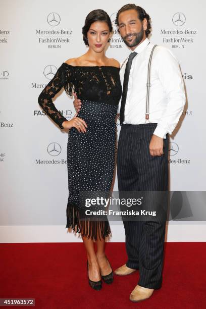 Rebecca Mir and Massimo Sinato attend the Laurel show during the Mercedes-Benz Fashion Week Spring/Summer 2015 at Erika Hess Eisstadion on July 10,...