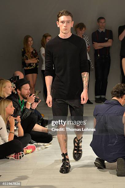 Model poses at the Sopopular show during the Mercedes-Benz Fashion Week Spring/Summer 2015 at Erika Hess Eisstadion on July 10, 2014 in Berlin,...