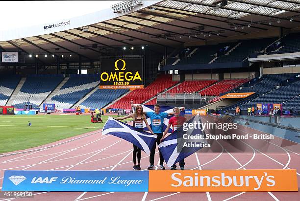 Eilish McColgan, Chris O'Hare and Eilidh Child of Scotland pose during a photo call ahead of the Sainsbury's Glasgow Grand Prix on July 10, 2014 at...