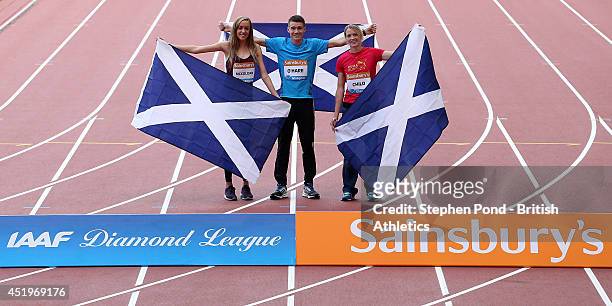 Eilish McColgan, Chris O'Hare and Eilidh Child of Scotland pose during a photo call ahead of the Sainsbury's Glasgow Grand Prix on July 10, 2014 at...