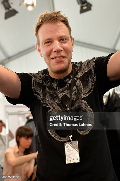 Designer Daniel Blechman poses at the Sopopular show during the Mercedes-Benz Fashion Week Spring/Summer 2015 at Erika Hess Eisstadion on July 10,...