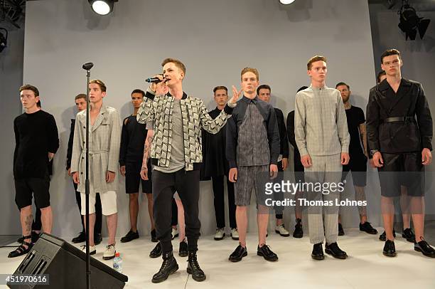 Models pose at the Sopopular show during the Mercedes-Benz Fashion Week Spring/Summer 2015 at Erika Hess Eisstadion on July 10, 2014 in Berlin,...
