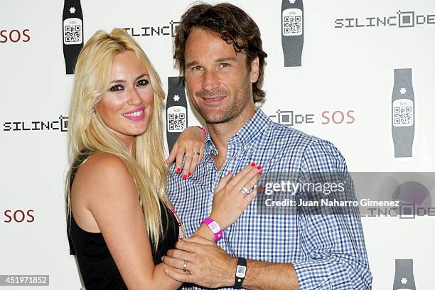 Carolina Cerezuela and Carlos Moya attend Omega Pharma Silincode SOS Charity Bracelet presentation on July 10, 2014 in Madrid, Spain.