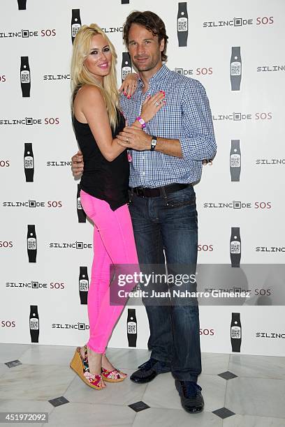 Carolina Cerezuela and Carlos Moya attend Omega Pharma Silincode SOS Charity Bracelet presentation on July 10, 2014 in Madrid, Spain.