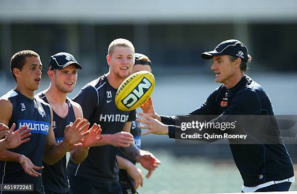 Dean Laidley the assistant coach of the Blues trains his players during a Carlton Blues AFL training session at Visy Park on November 26, 2013 in...