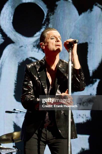 Singer Dave Gahan of Depeche Mode performs live during a concert at the O2 World on November 25, 2013 in Berlin, Germany.